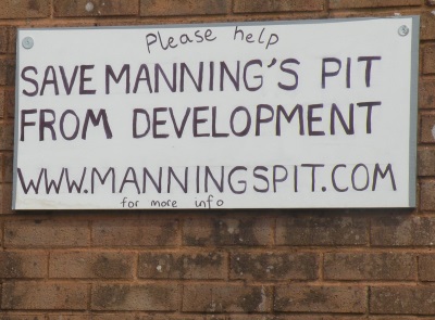 Sign on garage wall, Windsor Road, close to
                Maning's Pit